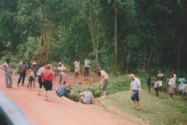 Collecting water from a roadside creek, Zaire.