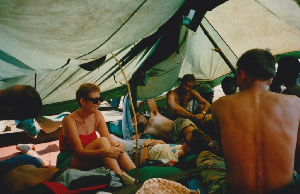Sheltering from the sun aboard the MB Lokole, Zaire River.
